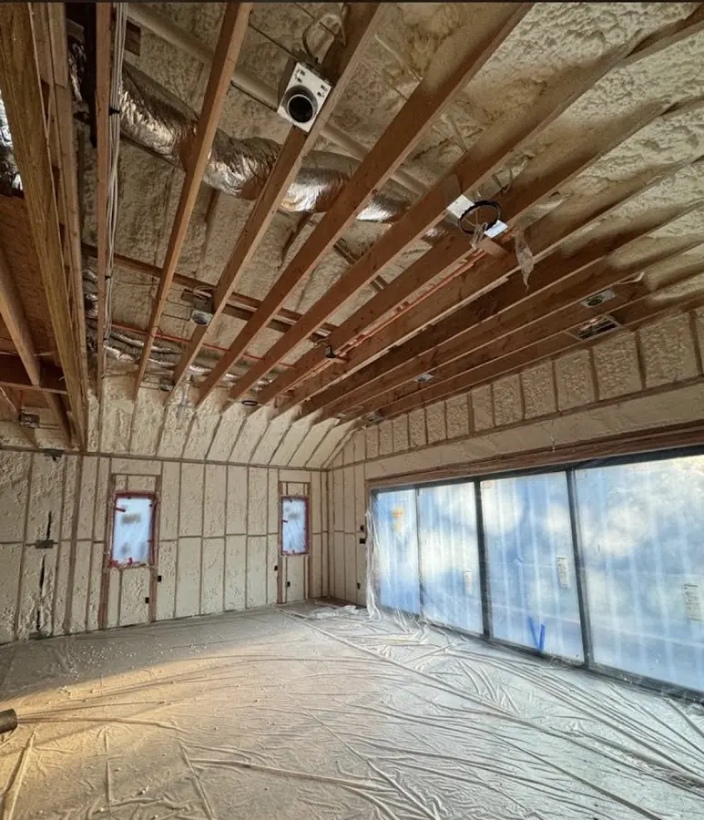 Interior walls and ceiling insulated with spray foam during new construction in Woodbury